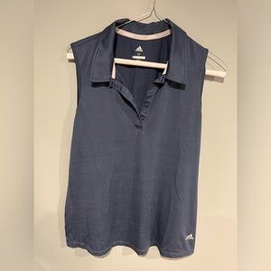 Adidas women’s blue sleeveless golf shirt, medium never worn.